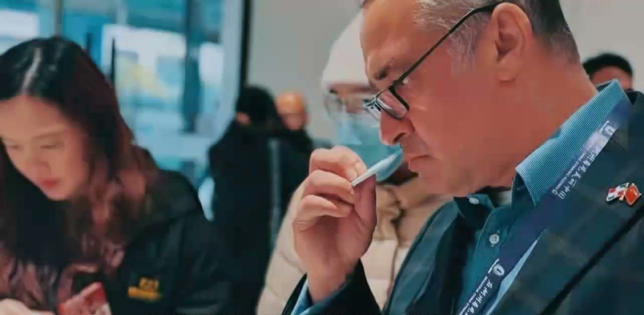 Customer smelling fragrance samples in the YFF showroom